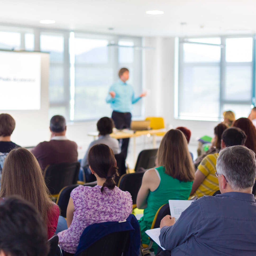 Person presenting to a class.