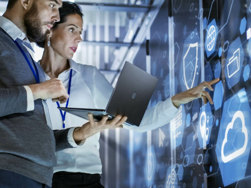 Two people looking at screens.